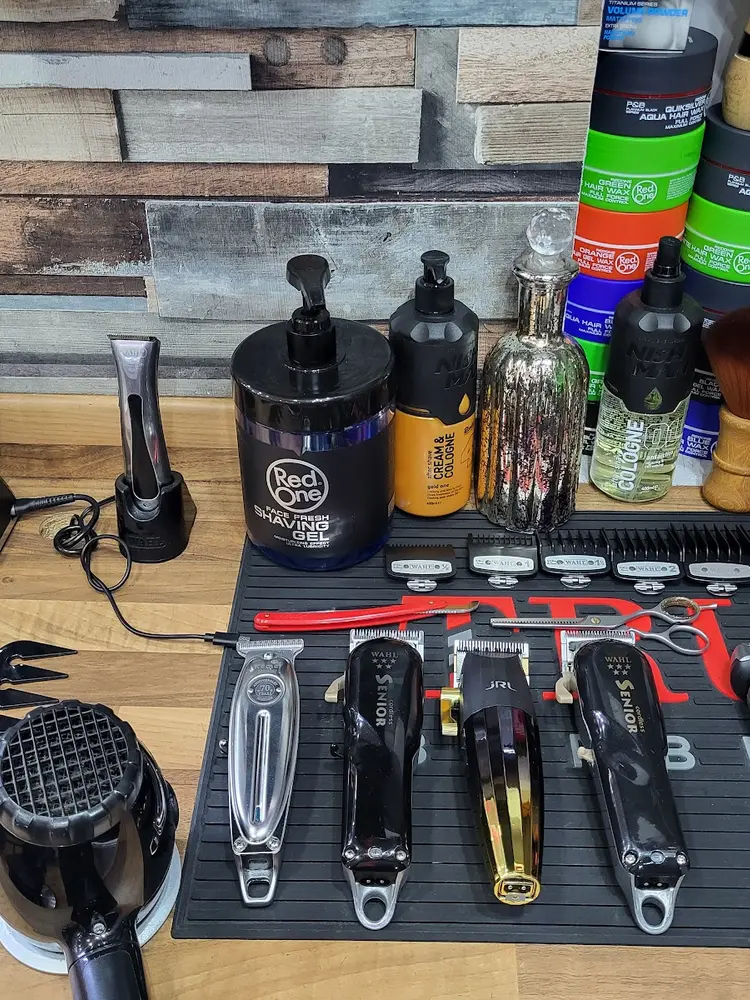 Clippers and grooming tools laid out on the wax wall